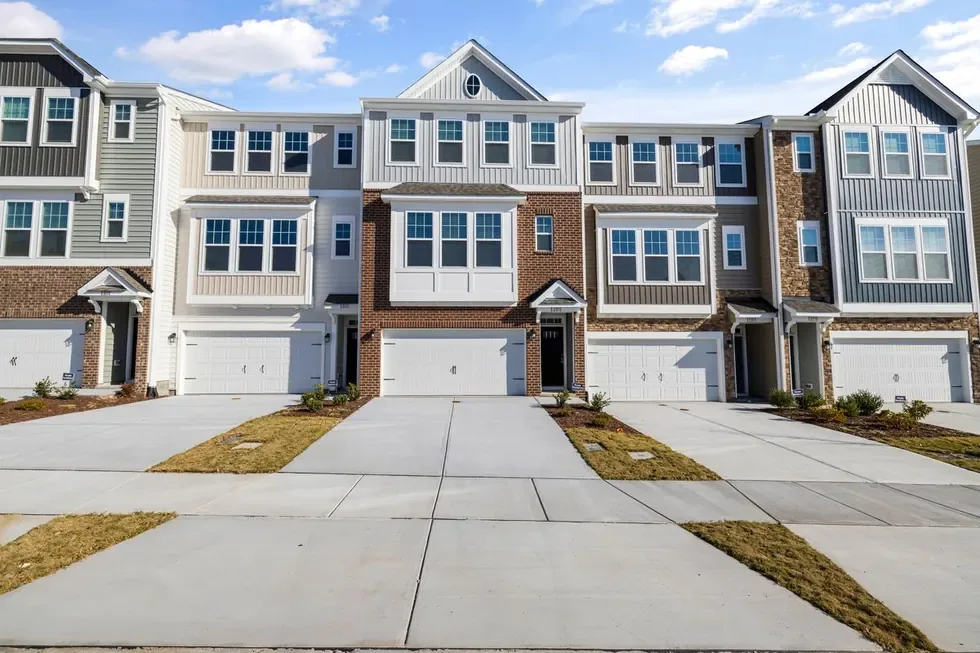 Townhomes with wide concrete driveways